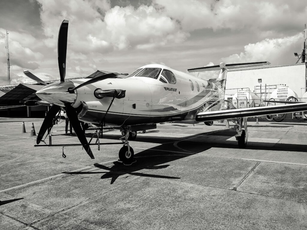 pexels-photo-868940-868940 Black and white image of a modern aircraft at Bogotá airport under a cloudy sky.